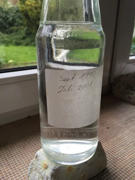 A sealed glass bottle of dynamized water kept clear for 17 years