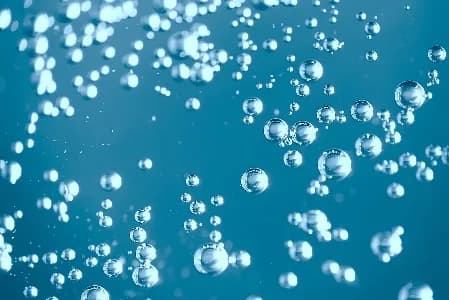 Oxygen bubbles rising through water